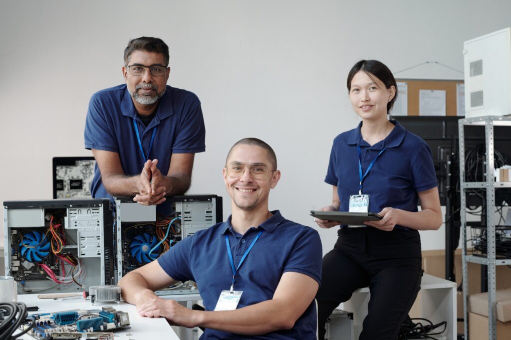 Team of IT Technicians Collaborating in Office