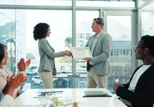 Business man, applause or handshake for award, congratulations or excellence certificate. Happy gro